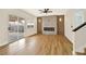 Living room features a decorative fireplace, ceiling fan and sliding glass doors at 6388 Canyon Dawn Ave, Las Vegas, NV 89108