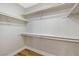 Walk-in closet features built-in shelves and hardwood flooring at 6388 Canyon Dawn Ave, Las Vegas, NV 89108