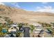 A high angle shot of a community showing homes in a desert landscape at 6999 Stone Meadows Ave, Las Vegas, NV 89142