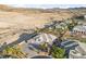 A high angle real estate shot showing a home in a desert community at 6999 Stone Meadows Ave, Las Vegas, NV 89142