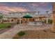 Outdoor bar area on a stone patio, ideal for entertaining guests in a beautiful backyard setting at 6999 Stone Meadows Ave, Las Vegas, NV 89142