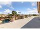 Large balcony overlooking a pool, palm trees, and other neighborhood houses at 6999 Stone Meadows Ave, Las Vegas, NV 89142