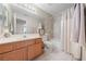 Clean bathroom featuring dual vanity, bright light, and combined shower-tub at 6999 Stone Meadows Ave, Las Vegas, NV 89142