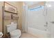 Modern bathroom featuring a shower-tub combination, bright light and neutral colors at 6999 Stone Meadows Ave, Las Vegas, NV 89142