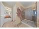 Updated bathroom with a walk-in shower, glass door, and tile flooring at 6999 Stone Meadows Ave, Las Vegas, NV 89142