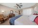 Bedroom with a ceiling fan, a large closet, and a vanity with a sewing machine and decor at 6999 Stone Meadows Ave, Las Vegas, NV 89142