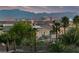 Beautiful home featuring lush landscaping and a stunning backdrop of the cityscape and mountains at 6999 Stone Meadows Ave, Las Vegas, NV 89142