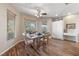 Bright dining room with hardwood flooring, complemented by a table, chairs, and windows providing natural light at 6999 Stone Meadows Ave, Las Vegas, NV 89142