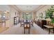 Elegant dining room with formal seating, decorative window treatments, and ample natural light at 6999 Stone Meadows Ave, Las Vegas, NV 89142