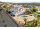 Aerial view of a two-story home with large driveway and desert landscaping at 6999 Stone Meadows Ave, Las Vegas, NV 89142