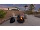 Outdoor fire pit with seating area, perfect for cozy evenings and entertaining guests at 6999 Stone Meadows Ave, Las Vegas, NV 89142