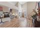 Spacious foyer with soaring ceilings, wood-look floors, and an open layout to the living area at 6999 Stone Meadows Ave, Las Vegas, NV 89142