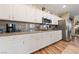 This kitchen boasts granite countertops, stainless steel appliances and hardwood flooring at 6999 Stone Meadows Ave, Las Vegas, NV 89142
