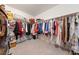 Spacious walk-in closet with ample storage and clothing racks at 6999 Stone Meadows Ave, Las Vegas, NV 89142