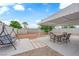 Backyard featuring covered patio with outdoor furniture, swing, and landscaping at 721 Carpenter Dr, Las Vegas, NV 89107