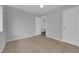 Bedroom with neutral walls, tiled floors, and a large closet at 721 Carpenter Dr, Las Vegas, NV 89107