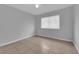 Bedroom featuring a large window, neutral walls, and tiled floors at 721 Carpenter Dr, Las Vegas, NV 89107