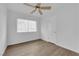 Bright bedroom with hardwood floors, ceiling fan, and a window at 721 Carpenter Dr, Las Vegas, NV 89107