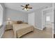 Cozy bedroom with a ceiling fan, neutral walls, and a comfortable queen-sized bed at 721 Carpenter Dr, Las Vegas, NV 89107