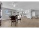 Open dining area with wood floors, white walls, and sliding door access to the backyard at 721 Carpenter Dr, Las Vegas, NV 89107