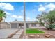 Charming single-story home with a well-manicured front yard and a gray door and garage, offering great curb appeal at 721 Carpenter Dr, Las Vegas, NV 89107