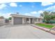 Charming single-story home featuring a well-maintained front yard and a gray color scheme at 721 Carpenter Dr, Las Vegas, NV 89107