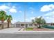 Charming single-story home with a well-manicured front yard, mature landscaping, and a spacious driveway at 721 Carpenter Dr, Las Vegas, NV 89107