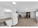 Open-concept kitchen and dining area with white appliances and wood-look floors at 721 Carpenter Dr, Las Vegas, NV 89107