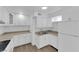 Modern kitchen with white cabinets, updated countertops, and wood-style flooring at 721 Carpenter Dr, Las Vegas, NV 89107