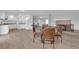 Combined dining, kitchen, and living area with wood flooring and natural light at 721 Carpenter Dr, Las Vegas, NV 89107