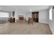 Open-concept living space featuring wood floors, a cozy fireplace, and dining area at 721 Carpenter Dr, Las Vegas, NV 89107