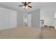 Neutral main bedroom featuring a ceiling fan, ensuite bathroom, and closet at 721 Carpenter Dr, Las Vegas, NV 89107