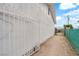 A shot of the side yard of the home featuring gravel, grass, and fencing at 721 Carpenter Dr, Las Vegas, NV 89107