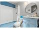 Freshly renovated bathroom with blue accents, new fixtures, and a modern design at 7400 Amigo St, Las Vegas, NV 89123