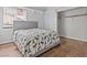 Bedroom with light gray walls, wood floor, a window with blinds and a double bed at 7400 Amigo St, Las Vegas, NV 89123