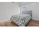 Bedroom with light gray walls, wood floor, a window with blinds and a double bed at 7400 Amigo St, Las Vegas, NV 89123