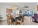 Open-concept dining room flows into living area, featuring a fireplace and tile floors at 7400 Amigo St, Las Vegas, NV 89123