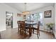 Dining room with wood floors, natural light, and modern pendant lighting at 7400 Amigo St, Las Vegas, NV 89123