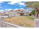 Charming two-story home with a well-manicured lawn and a spacious driveway at 7400 Amigo St, Las Vegas, NV 89123