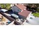 An aerial view captures the house exterior, with tiled roof, block wall fencing, concrete parking and modest landscaping at 7400 Amigo St, Las Vegas, NV 89123