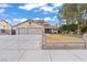 A charming home with a well-maintained front yard and a two-car garage at 7400 Amigo St, Las Vegas, NV 89123