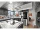 Modern kitchen featuring a center island with cooktop and stainless steel appliances at 7400 Amigo St, Las Vegas, NV 89123
