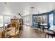 Open-concept living area with tile floors, fireplace, and stylish lighting fixtures at 7400 Amigo St, Las Vegas, NV 89123