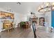 Open living room featuring tile floors, a fireplace, and a wet bar for entertaining at 7400 Amigo St, Las Vegas, NV 89123
