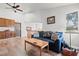 Inviting living room with wood floors, a comfortable sofa, and a view of the upper landing at 7400 Amigo St, Las Vegas, NV 89123