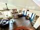 Spacious living room featuring hardwood floors, a brick fireplace, and plenty of natural light at 7400 Amigo St, Las Vegas, NV 89123