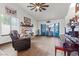 Bright living room with a brick fireplace, bay window, and polished wood floors at 7400 Amigo St, Las Vegas, NV 89123
