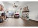 Cozy living room with a brick fireplace, hardwood floors, and comfortable seating near a dining area at 7400 Amigo St, Las Vegas, NV 89123