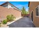 A spacious backyard patio features a brick wall and outdoor space at 7931 Mineral Peak St, Las Vegas, NV 89166