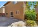 Exterior view of backyard patio with sliding door access and landscaping at 7931 Mineral Peak St, Las Vegas, NV 89166